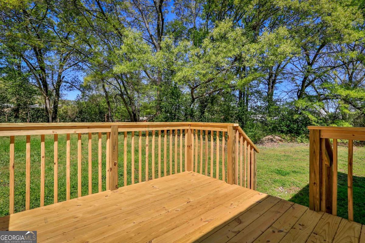 680 North Avenue Madison, GA 30650 - Photo 5 of 20 a balcony with wooden floor and outdoor space