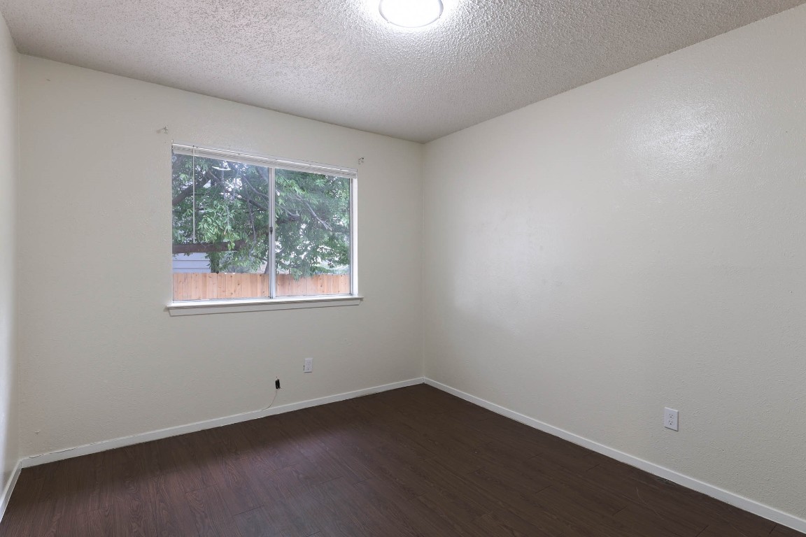 1915 Prairie Knoll Court, Unit B Austin, TX 78758 - Photo 12 of 15 an empty room with a window