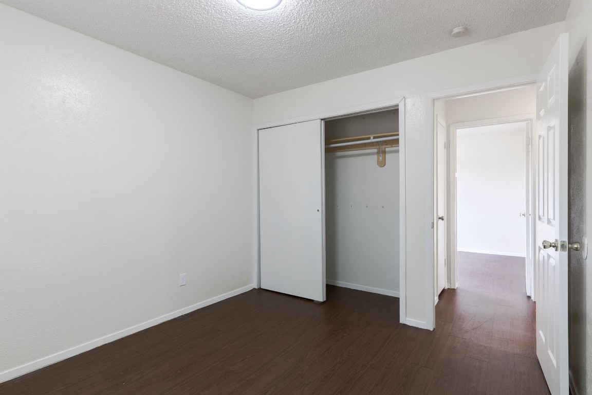 1915 Prairie Knoll Court, Unit B Austin, TX 78758 - Photo 13 of 15 an empty room with closet area