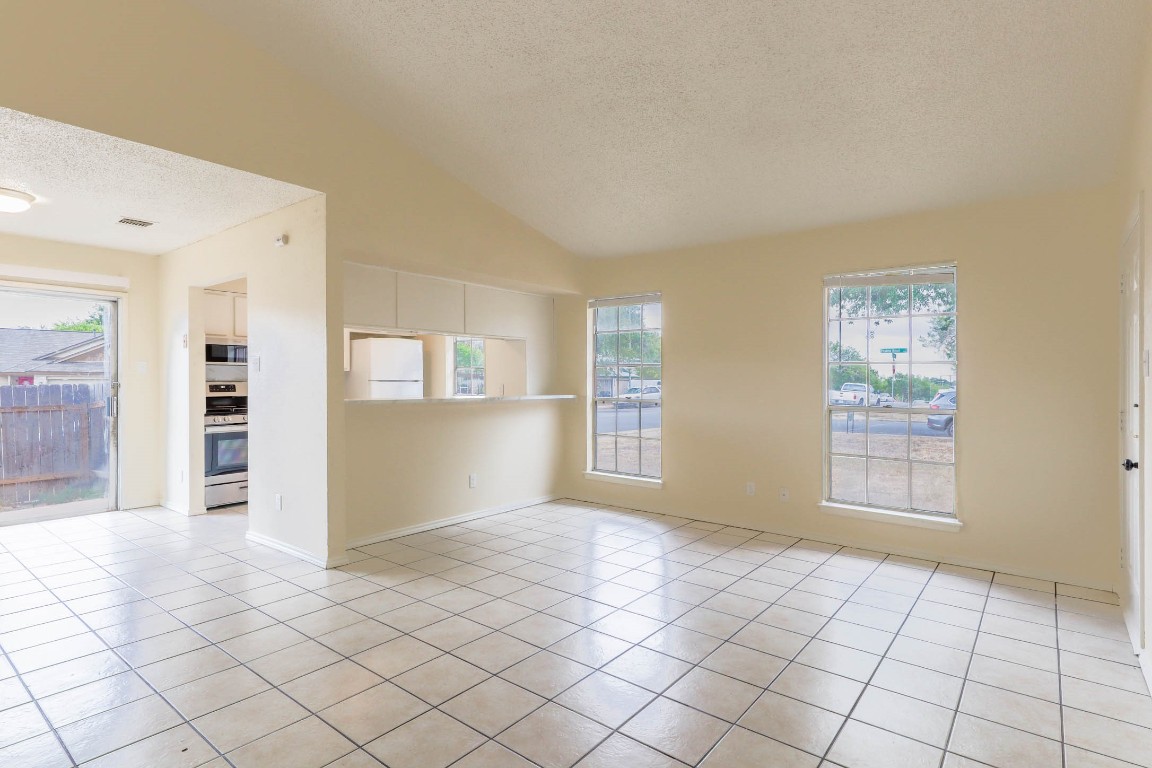 1915 Prairie Knoll Court, Unit B Austin, TX 78758 - Photo 2 of 15 a view of an empty room and window