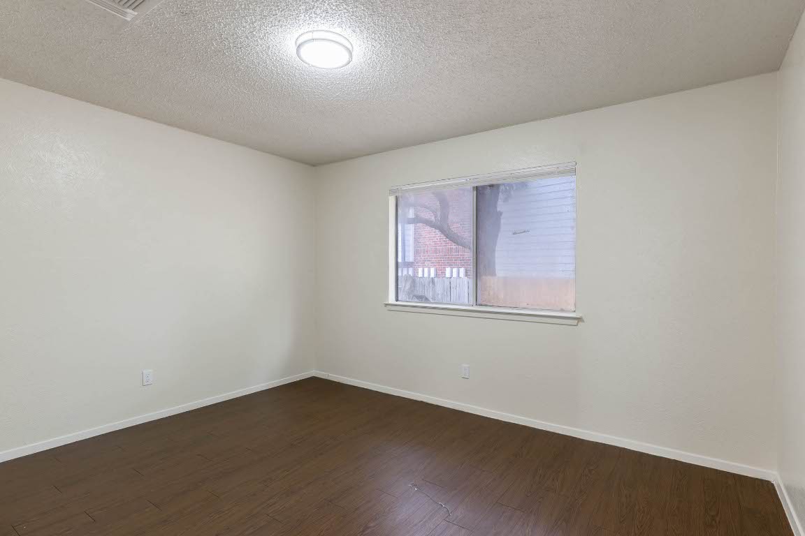 1915 Prairie Knoll Court, Unit B Austin, TX 78758 - Photo 6 of 15 an empty room with a window