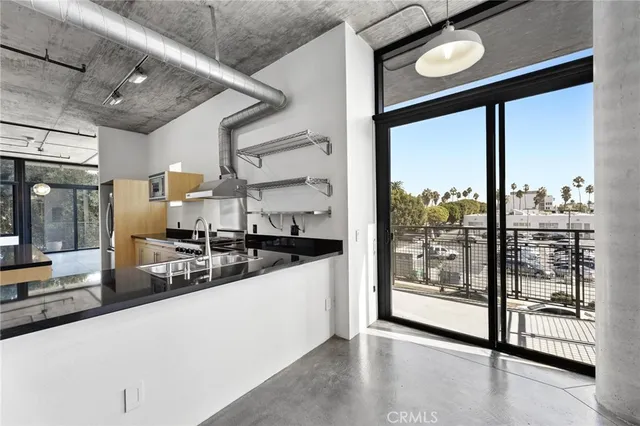a view of a patio with table and chairs