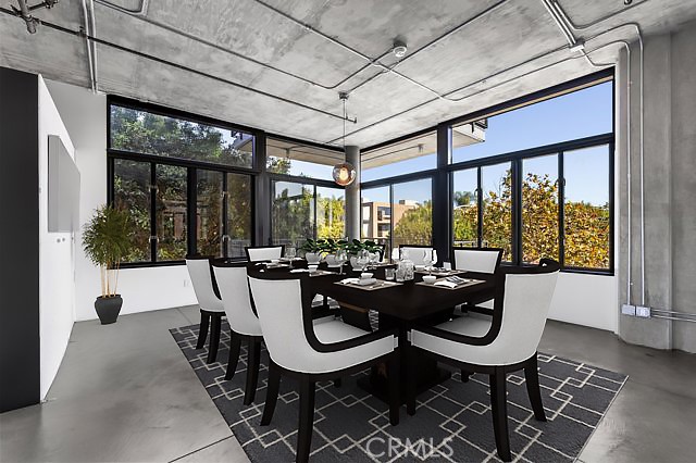 835 Locust Avenue, Unit 322 Long Beach, CA 90813 - Photo 20 of 42 a view of a dining room with furniture large windows and wooden floor