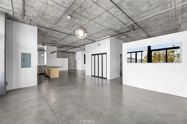 a dining room with furniture window and wooden floor