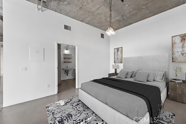 835 Locust Avenue, Unit 322 Long Beach, CA 90813 - Photo 24 of 42 a bedroom with a bed and a walk in closet