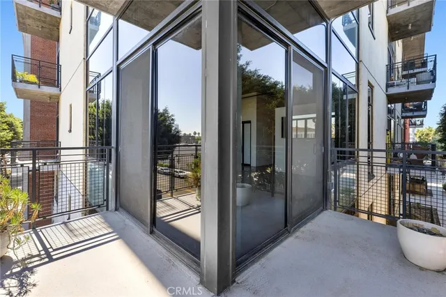 a view of gallery with wooden floor