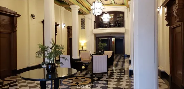 a view of parking garage with cars parked