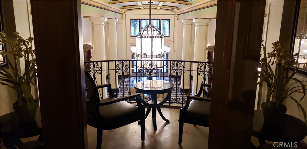 835 Locust Avenue, Unit 322 Long Beach, CA 90813 - Photo 33 of 42 a view of a balcony filled with furniture and chandelier