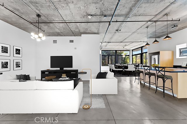 835 Locust Avenue, Unit 322 Long Beach, CA 90813 - Photo 5 of 42 a living room with furniture and a flat screen tv