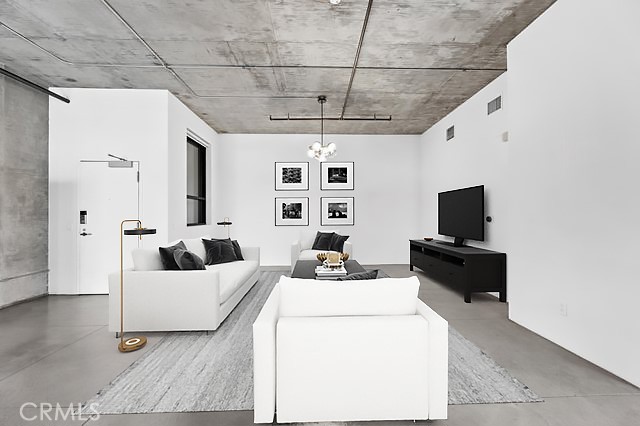 835 Locust Avenue, Unit 322 Long Beach, CA 90813 - Photo 7 of 42 a living room with furniture and a flat screen tv