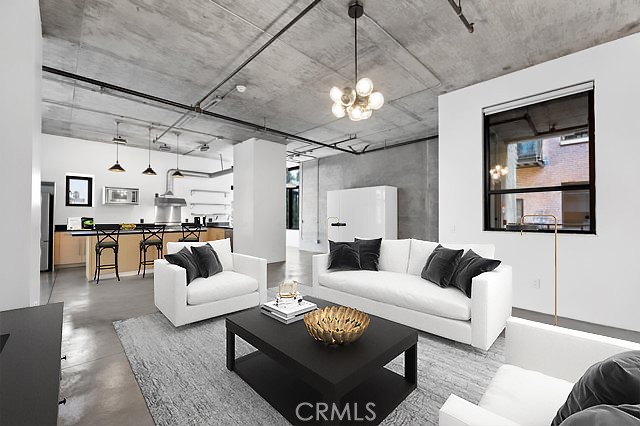 835 Locust Avenue, Unit 322 Long Beach, CA 90813 - Photo 8 of 42 a living room with furniture and a chandelier