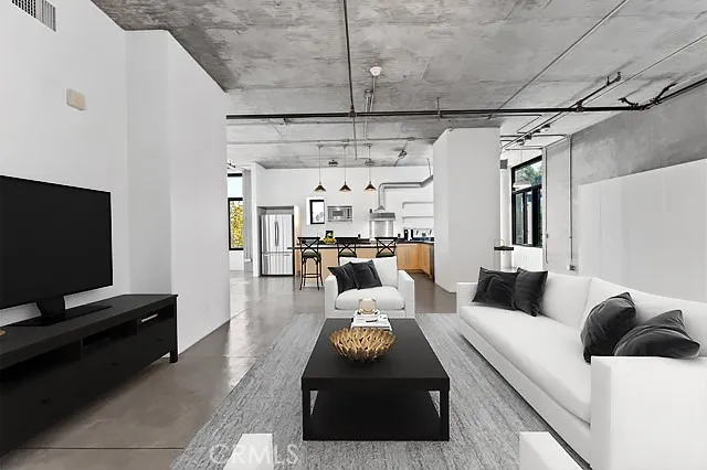 a kitchen with stainless steel appliances granite countertop a stove and a refrigerator