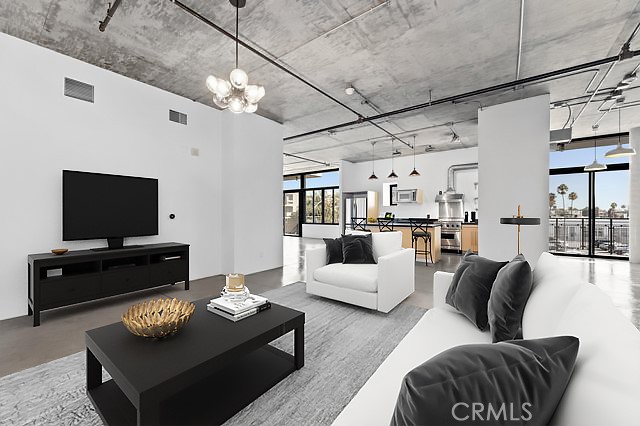 835 Locust Avenue, Unit 322 Long Beach, CA 90813 - Photo 10 of 42 a living room with furniture and a flat screen tv