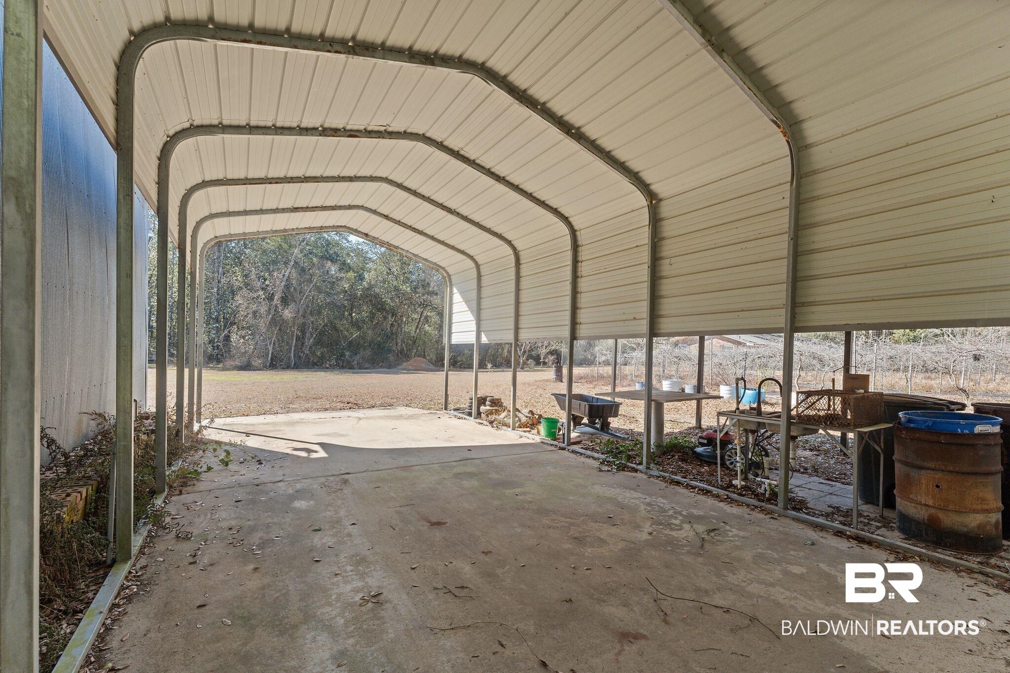 32989 Antietam Road Lillian, AL 36549 - Photo 35 of 56 View of parking featuring a carport