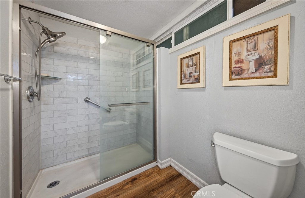 2158 North Magnolia Avenue Rialto, CA 92377 - Photo 17 of 23 a bathroom with a toilet and a shower