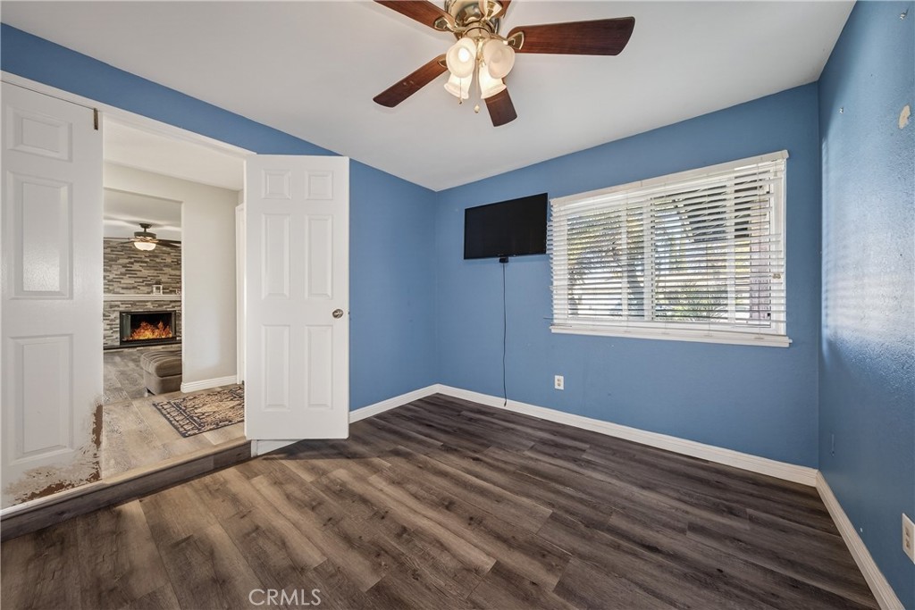 2158 North Magnolia Avenue Rialto, CA 92377 - Photo 21 of 23 a view of empty room with wooden floor and fan