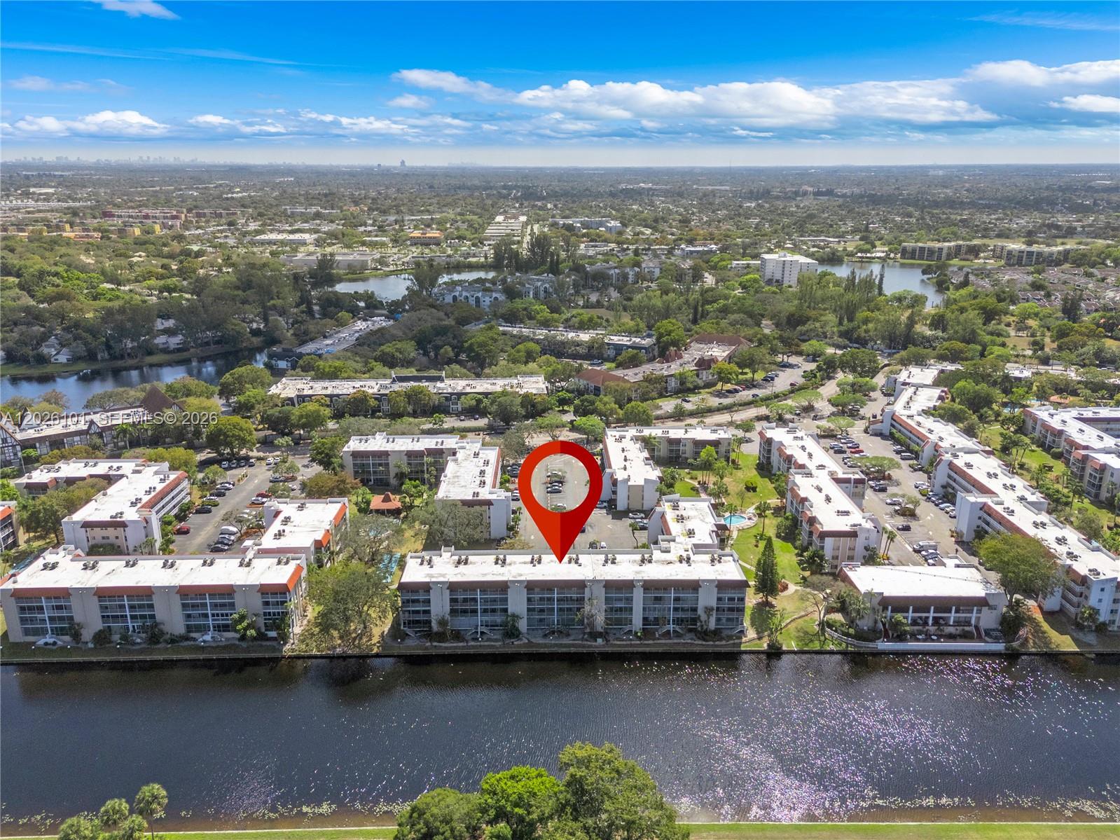 3551 Inverrary Drive, Unit 208 Lauderhill, FL 33319 - Photo 26 of 34 a view of a city with lots of car parked