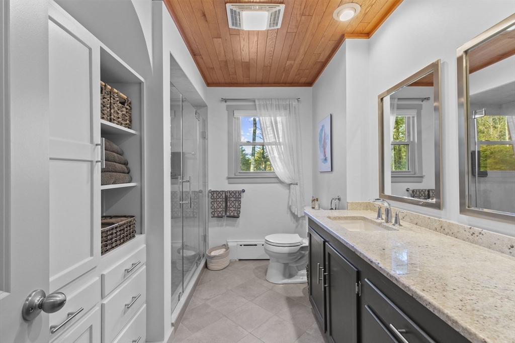 224 Snipatuit Road Rochester, MA 02770 - Photo 12 of 42 a spacious bathroom with a granite countertop sink a toilet and a shower