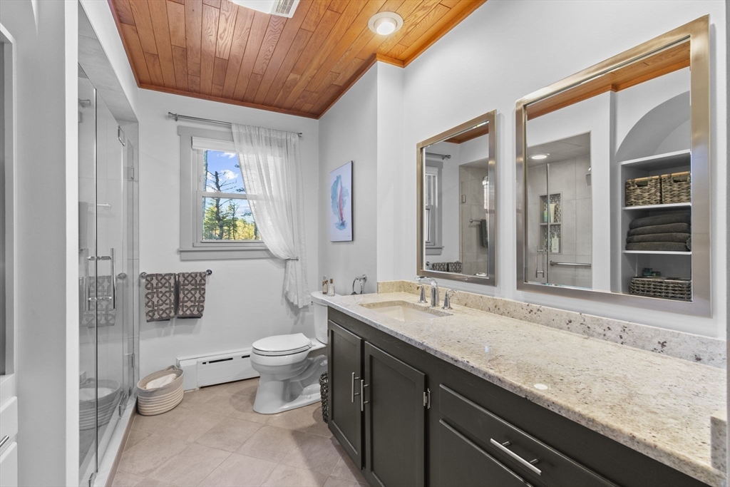 224 Snipatuit Road Rochester, MA 02770 - Photo 14 of 42 a bathroom with a granite countertop sink a toilet a mirror and shower
