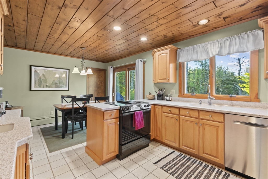 224 Snipatuit Road Rochester, MA 02770 - Photo 28 of 42 a large kitchen with lots of appliances and cabinets