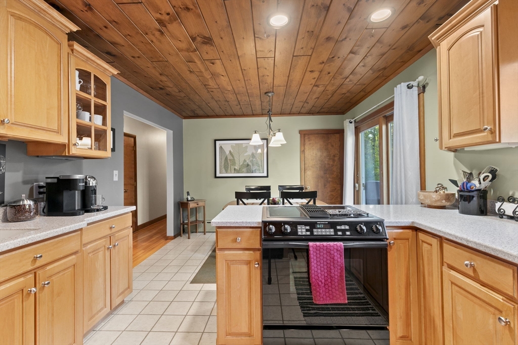 224 Snipatuit Road Rochester, MA 02770 - Photo 30 of 42 a kitchen with stainless steel appliances granite countertop a stove a sink dishwasher and cabinets with wooden floor