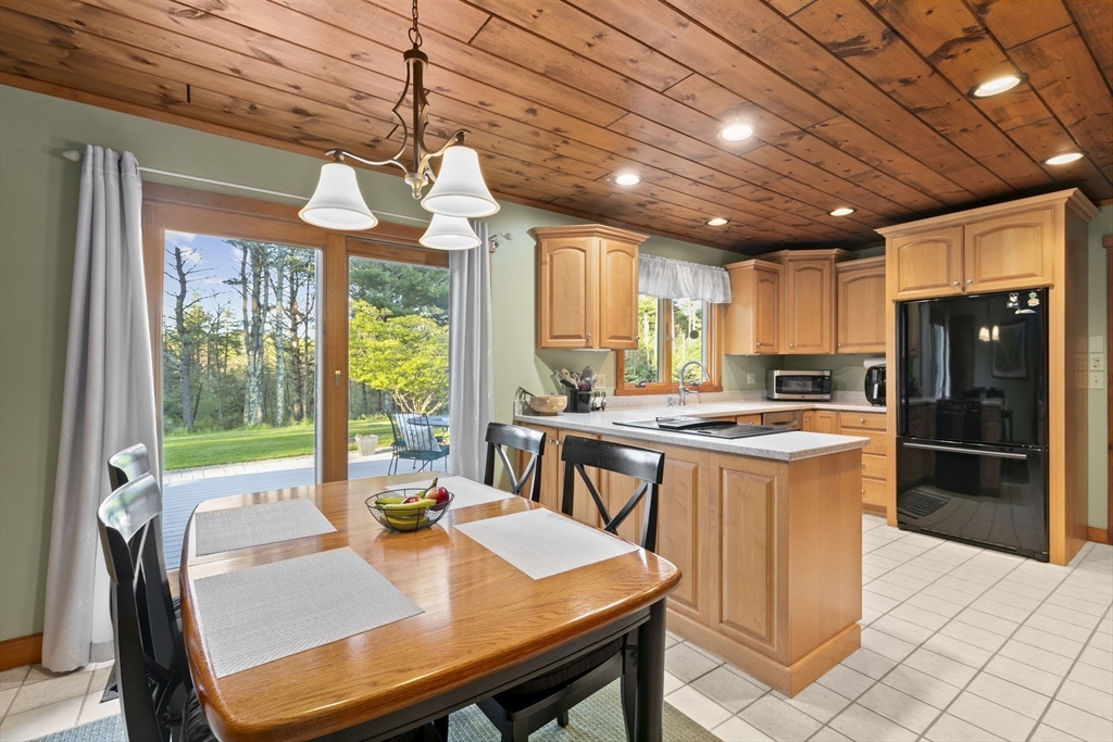 224 Snipatuit Road Rochester, MA 02770 - Photo 4 of 42 a view of a dining room with furniture window and outside view