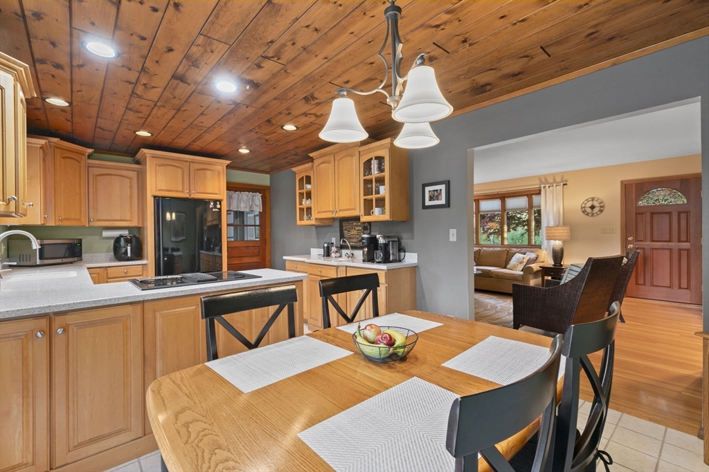224 Snipatuit Road Rochester, MA 02770 - Photo 5 of 42 a view of a dining room with furniture and wooden floor