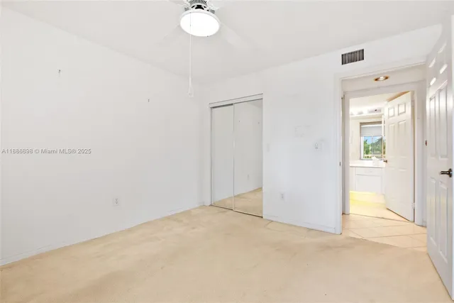 an empty room with mirror