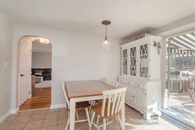 a bathroom with a sink a toilet and a window