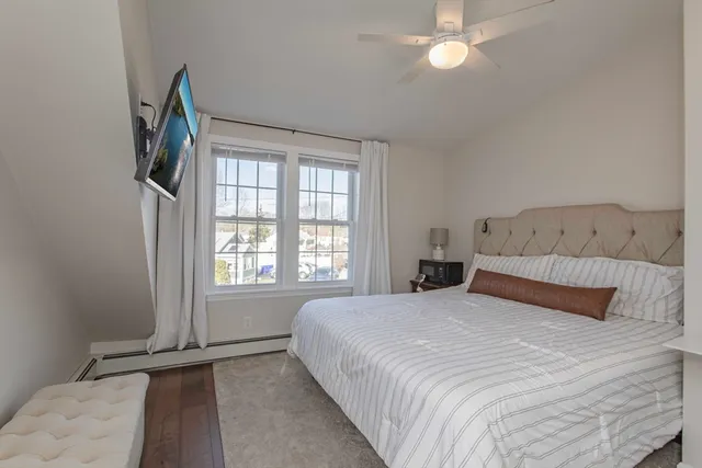 a bedroom with a bed and with couch