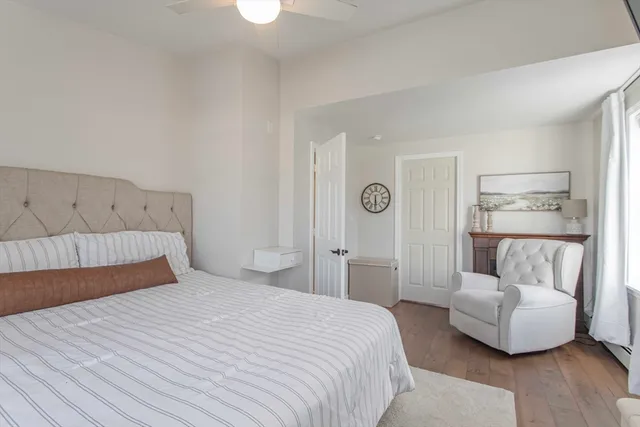 a bedroom with a bed and glass door
