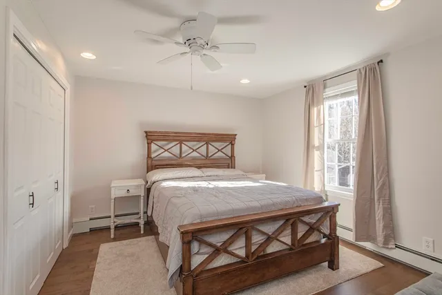 a bedroom with a bed and a table