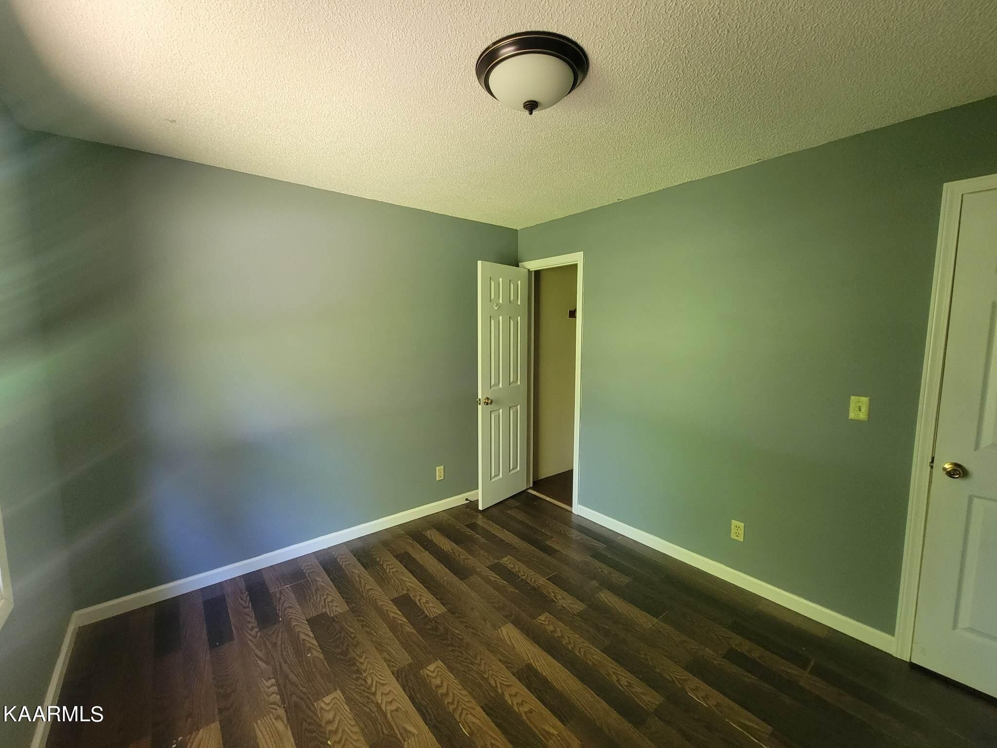 1054 Franklin Loop Clarkrange, TN 38553 - Photo 13 of 35 a view of a room with wooden floor and windows
