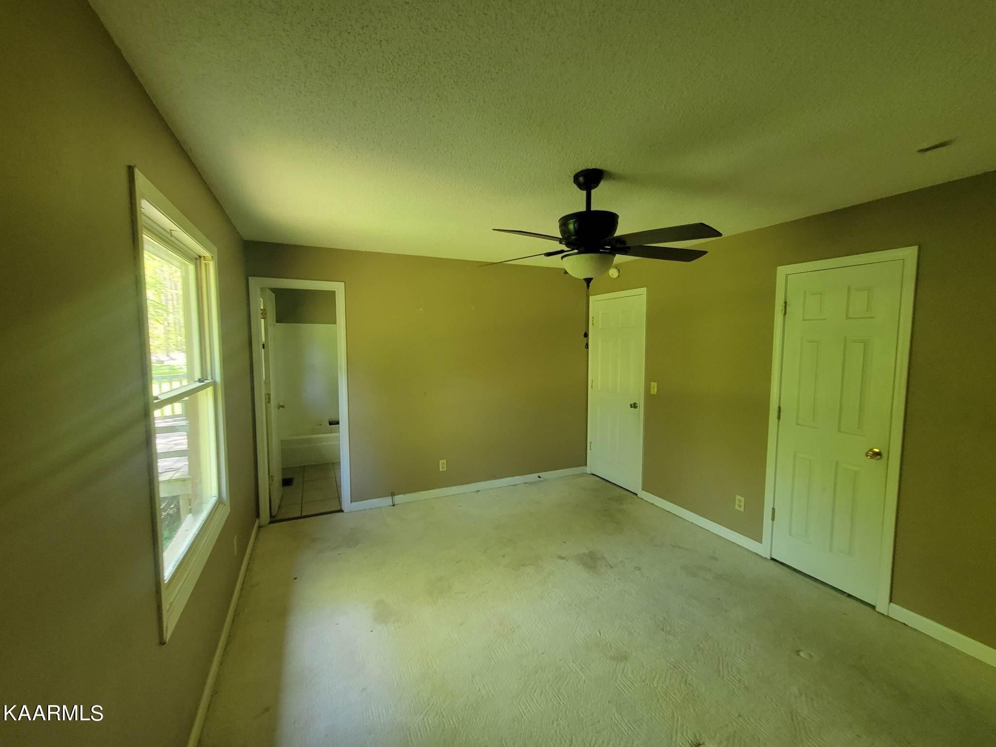 1054 Franklin Loop Clarkrange, TN 38553 - Photo 16 of 35 a view of empty room with a window and ceiling fan