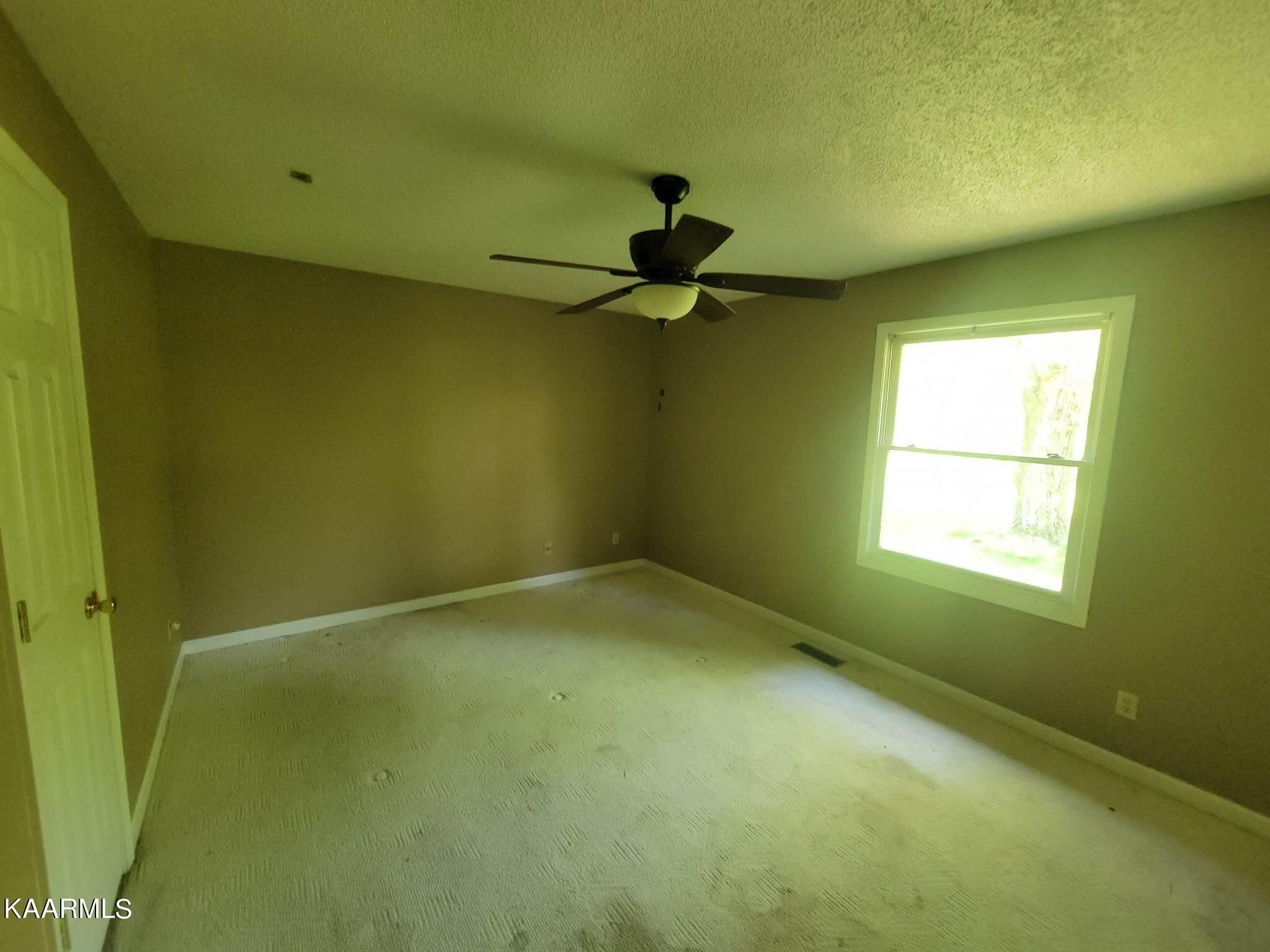 1054 Franklin Loop Clarkrange, TN 38553 - Photo 19 of 35 a view of empty room with windows