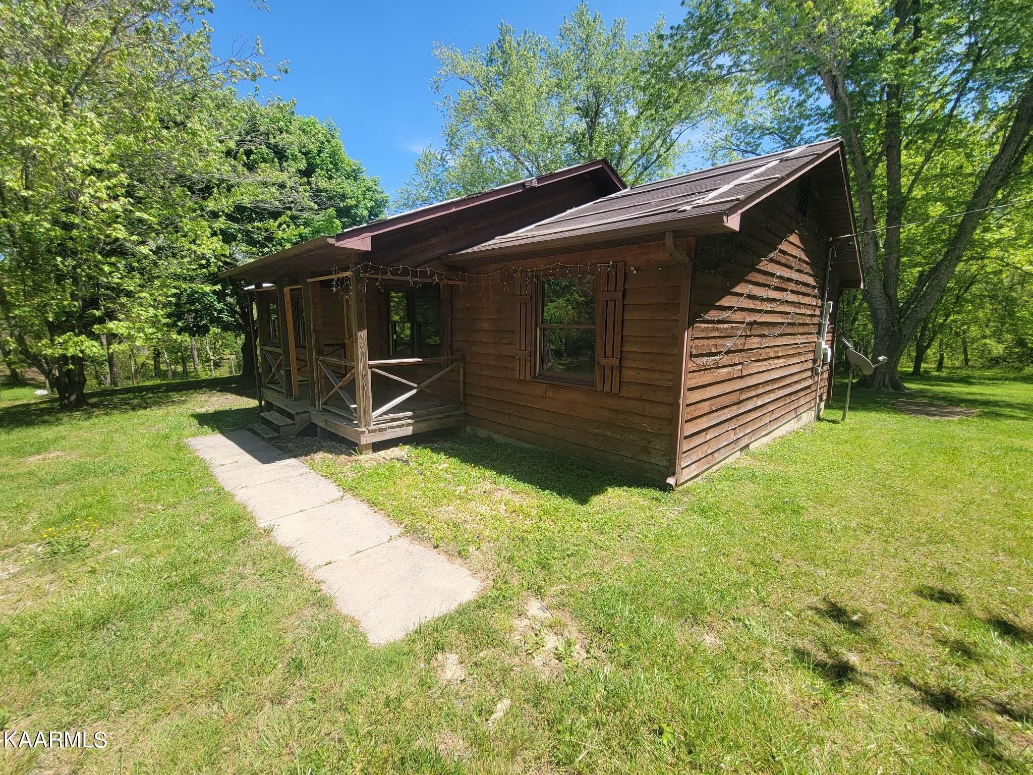 1054 Franklin Loop Clarkrange, TN 38553 - Photo 28 of 35 a view of backyard with wooden fence and large trees