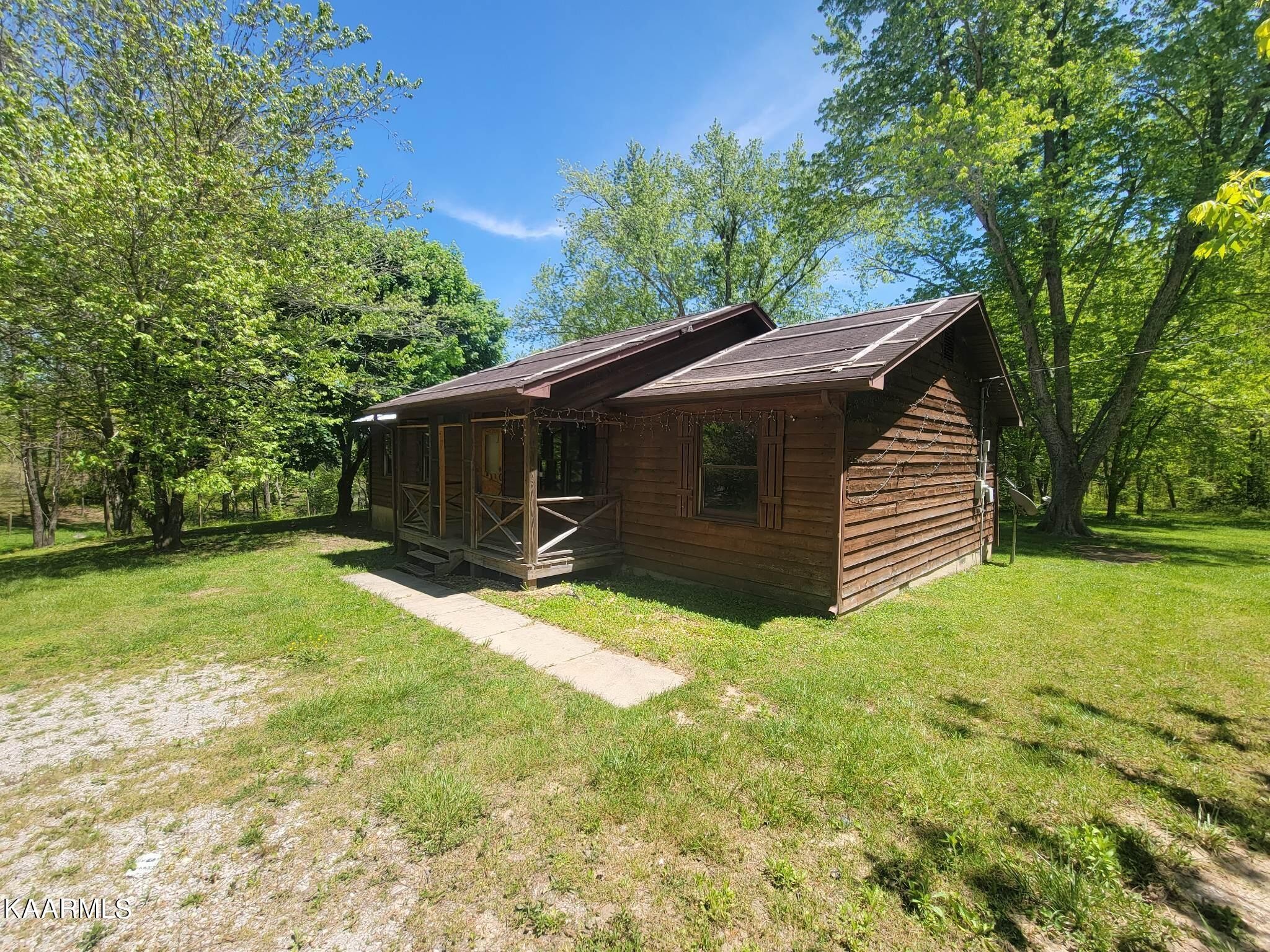 1054 Franklin Loop Clarkrange, TN 38553 - Photo 30 of 35 a view of a house with a yard