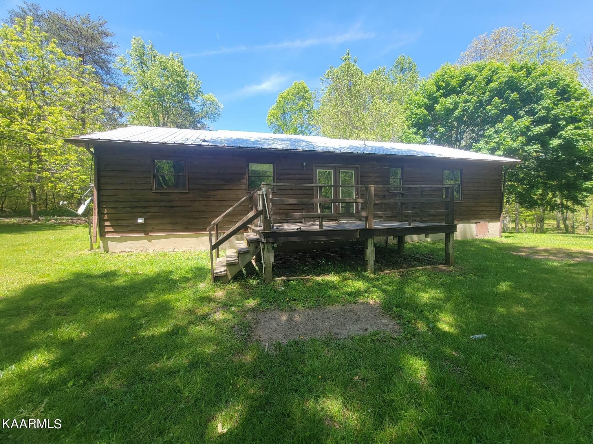 1054 Franklin Loop Clarkrange, TN 38553 - Photo 31 of 35 a view of a house with a yard