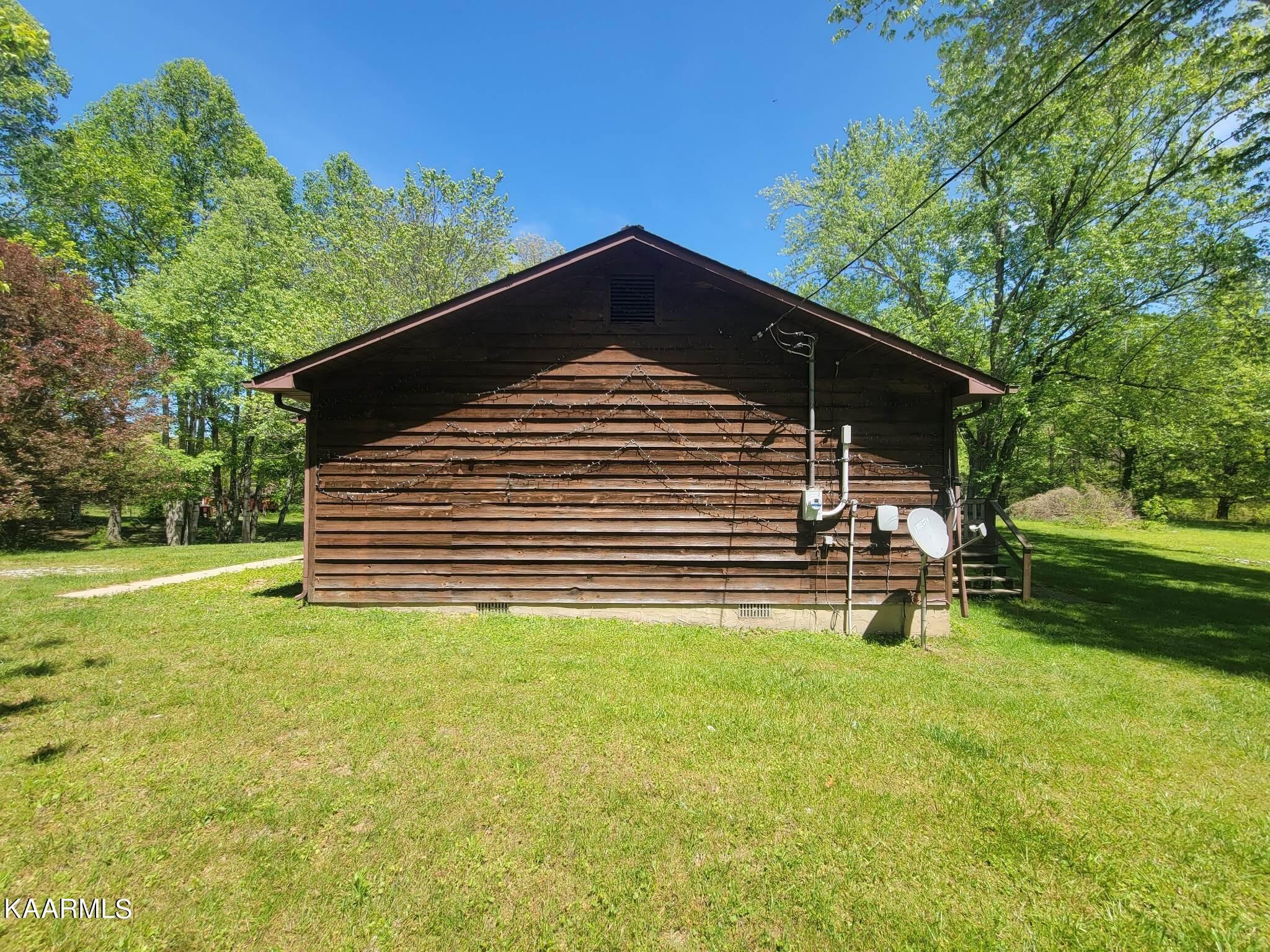 1054 Franklin Loop Clarkrange, TN 38553 - Photo 32 of 35 a view of a house with a yard