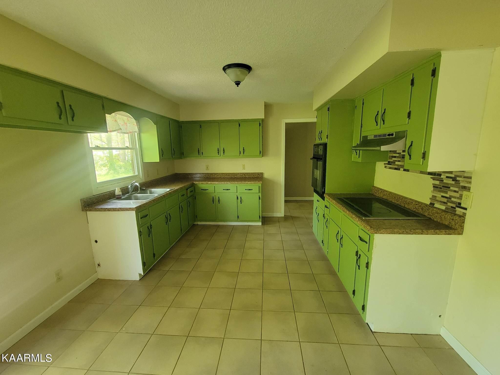 1054 Franklin Loop Clarkrange, TN 38553 - Photo 8 of 35 a kitchen with a sink a counter top space and cabinets