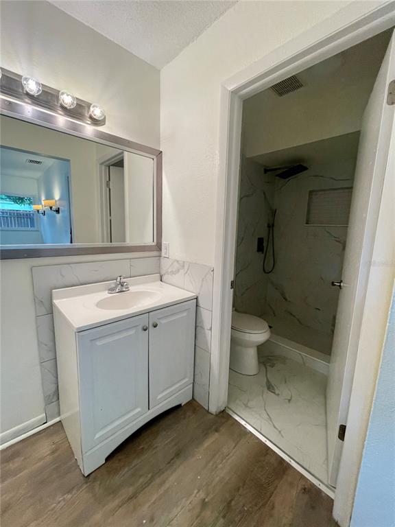 211 Stefanik Road Winter Park, FL 32792 - Photo 12 of 19 a bathroom with a sink a toilet and shower