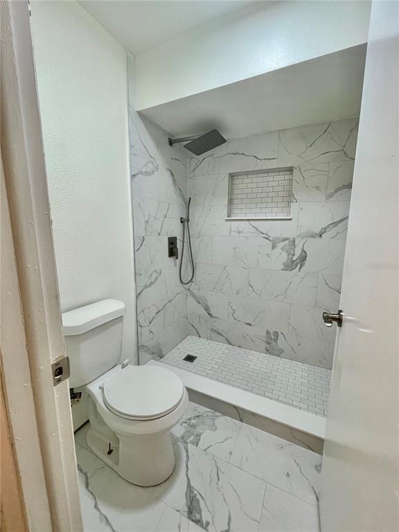 211 Stefanik Road Winter Park, FL 32792 - Photo 13 of 19 a bathroom with a toilet and a shower