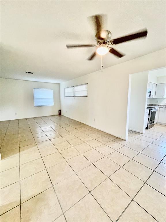 211 Stefanik Road Winter Park, FL 32792 - Photo 16 of 19 a view of a livingroom with wooden floor and a ceiling fan