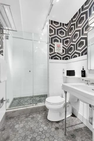 a kitchen with granite countertop a stove and a sink