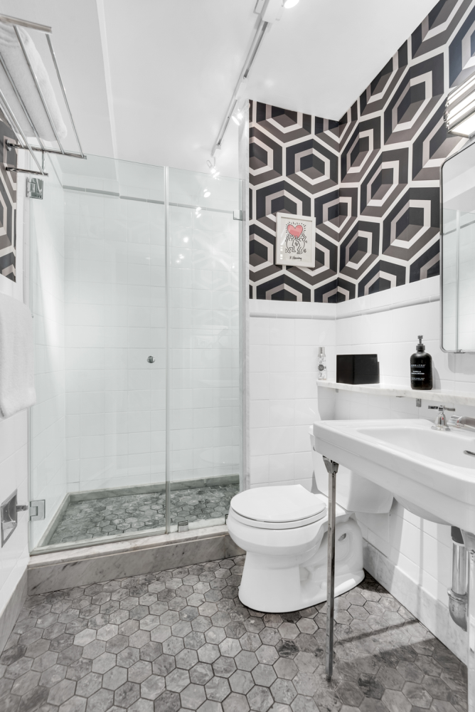 220 Madison Avenue, Unit 8H Manhattan, NY 10016 - Photo 5 of 10 a bathroom with a sink a toilet and shower