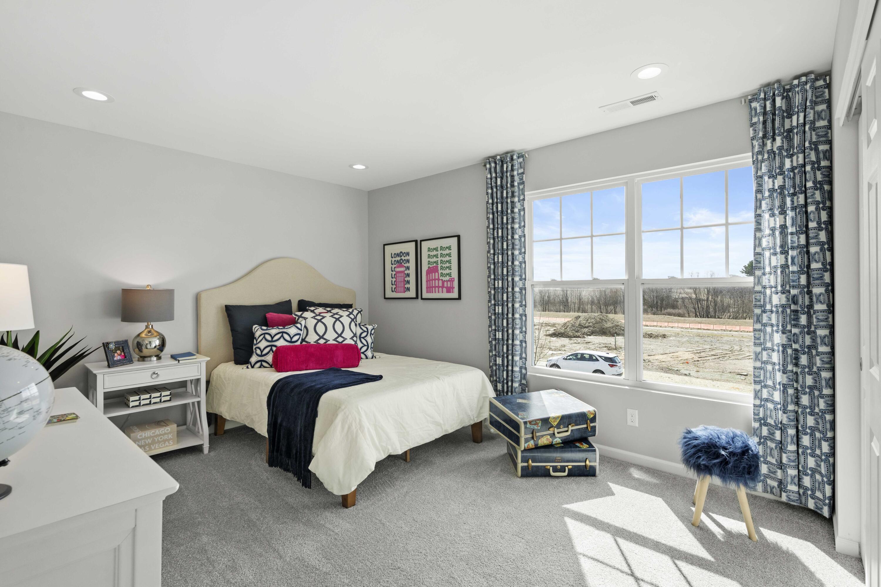6754 East 103rd Avenue Crown Point, IN 46307 - Photo 15 of 17 a bedroom with a bed and a couch