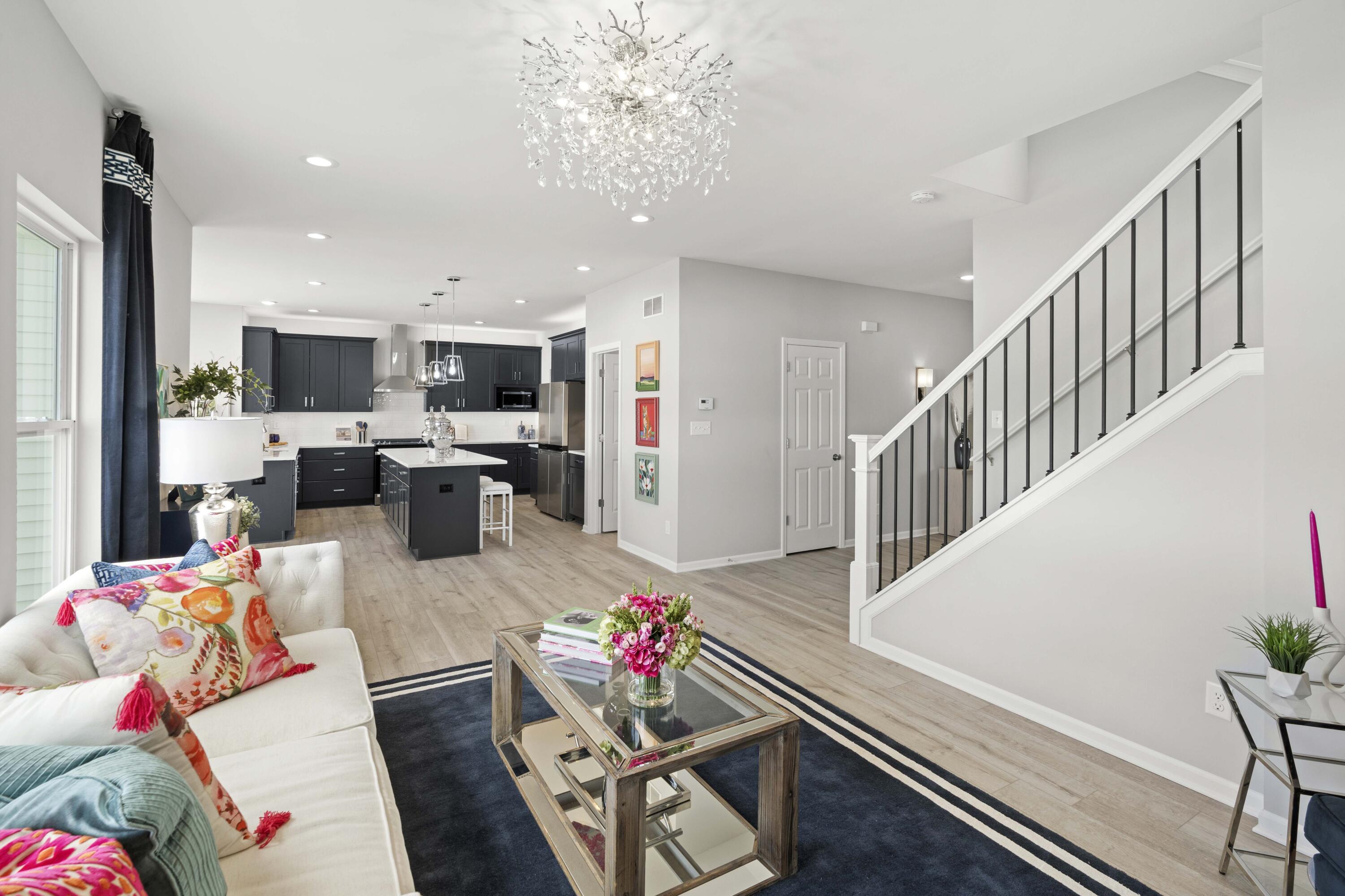 6754 East 103rd Avenue Crown Point, IN 46307 - Photo 6 of 17 a living room with furniture fireplace and a view of kitchen