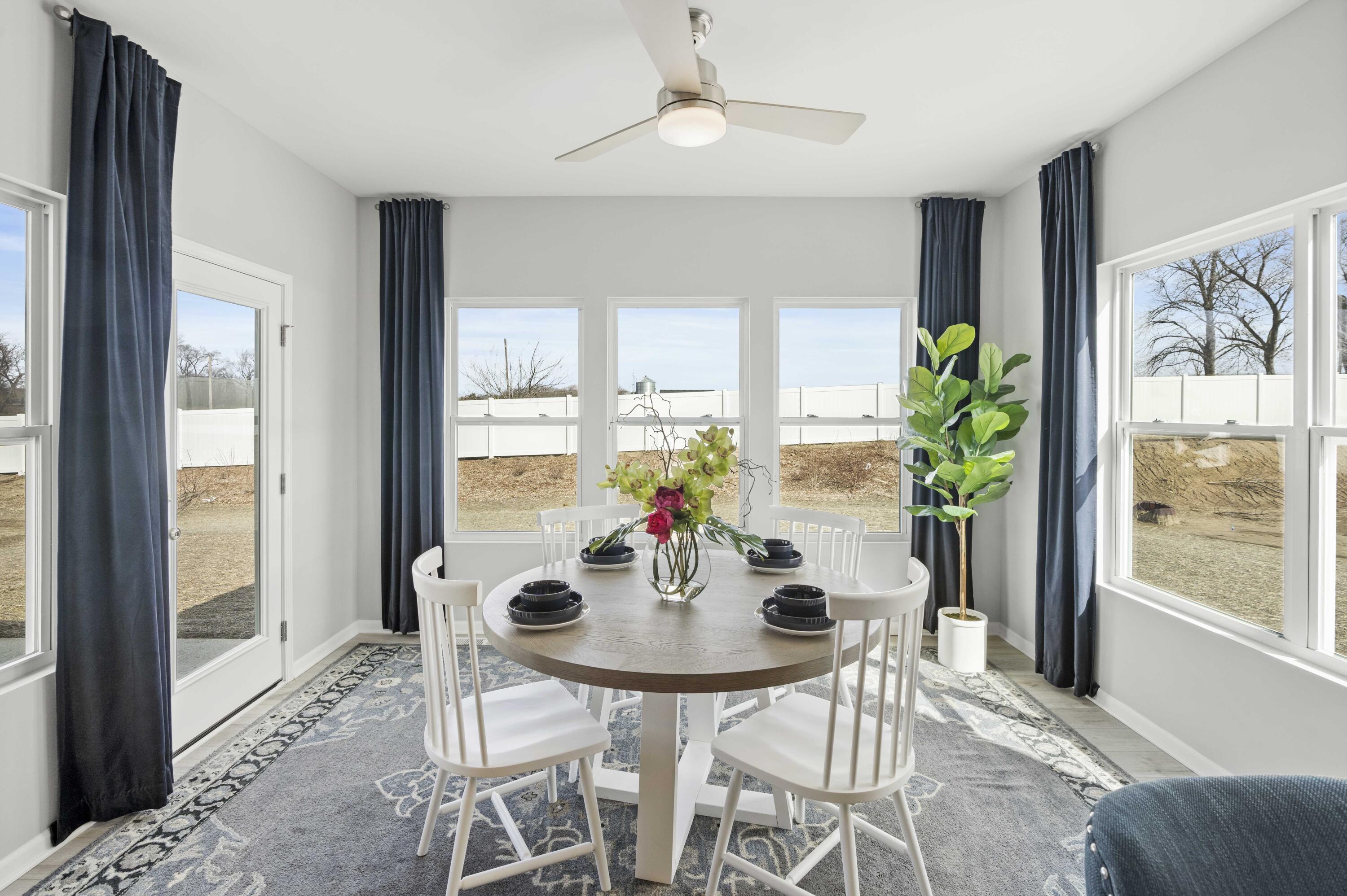 6754 East 103rd Avenue Crown Point, IN 46307 - Photo 10 of 17 a view of a dining room with furniture window and outside view