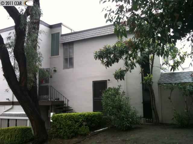 2043 Sierra Road, Unit 11 Concord, CA 94518 - Photo 1 of 1 a house that has a tree in front of it