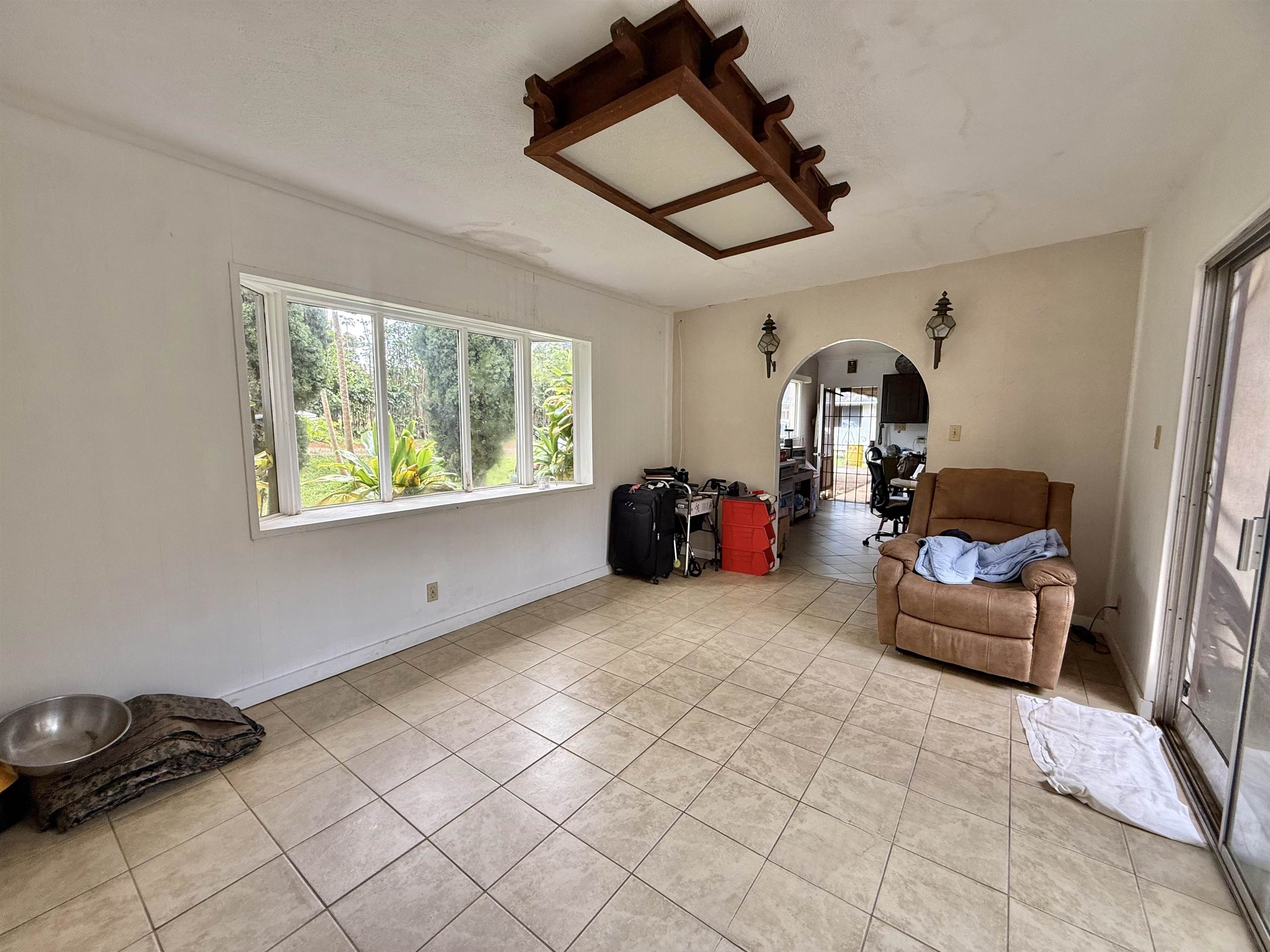 1630 Kauhikoa Road Haiku, HI 96708 - Photo 18 of 48 a living room with furniture and a window